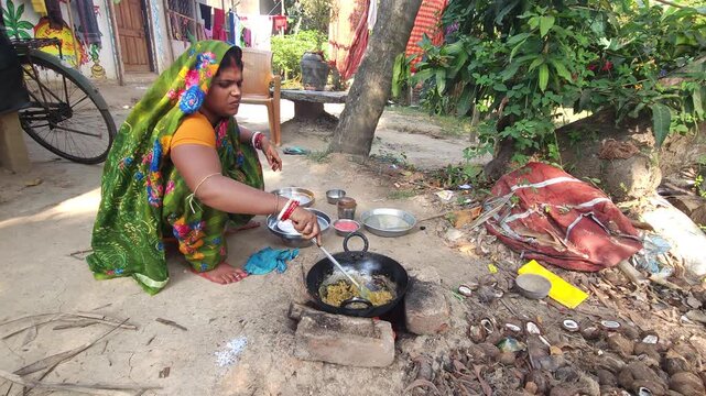 Rural Indian Woman Cooking Outdoors in Traditional Village Kitchen, Preparing Food on Wood Fire Chulha, Authentic Indian Lifestyle, Culture and Rural Life