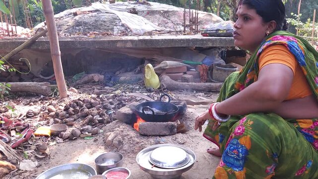 Rural Indian Woman Cooking Outdoors in Traditional Village Kitchen, Preparing Food on Wood Fire Chulha, Authentic Indian Lifestyle, Culture and Rural Life