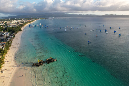 Drone Shot of Boracay Station 1 Coastline with Paraw Boats and Willy's Rock - 4