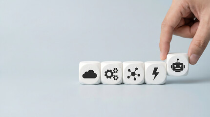 Fototapeta na wymiar Hand placing white cube with robot icon digital transformation automation workflow concept with cloud gears network and lightning symbols on gray background copy space