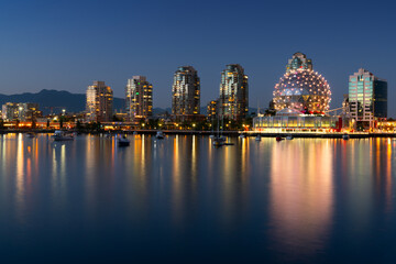 Obraz premium False Creek Dusk Lights.Lights reflect in False Creek from the geodesic dome of Science World. British Columbia, Canada. 
