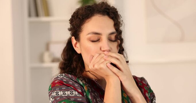 Woman playing harmonica at home. Musical instrument