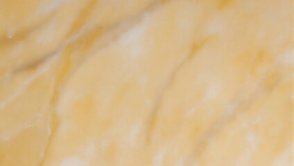 Natural polished golden marble surface with soft veins.