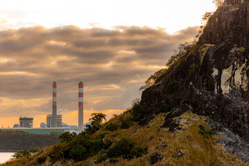 sunrise over a rural area and power plant