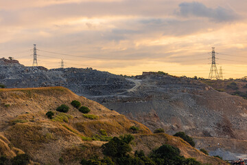 rock quarry power lines sunrise