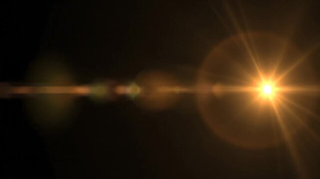 Golden Flare and Bokeh Effects Transitioning Across a Dark Screen Visual Background