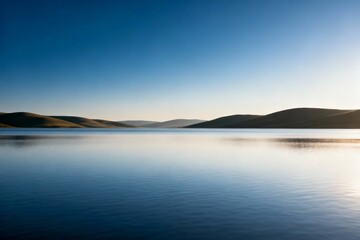 Fototapeta premium calm lake with rolling hills