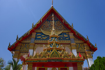 Ornate Thai temple facade with traditional spire in Phuket