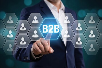 Business-to-Business concept: An executive hand's presses the B2B button, in the concept of global connections of professional business on a digital interface.