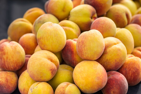a pile of fresh peaches. 
Peaches are a rich source of vitamins A, C, and E, as well as potassium and magnesium. 
They contain phytochemicals called phenols which act as antioxidants. 