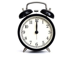 A black and white image of an analog alarm clock