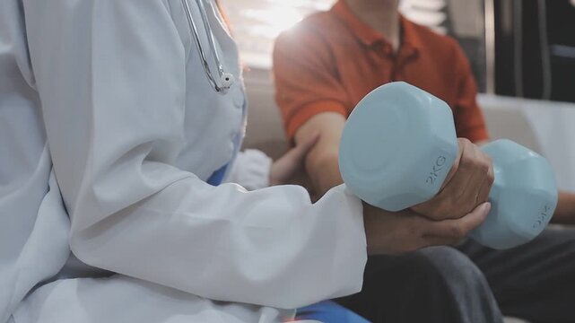 Dumbbells, physical therapy and old man with physiotherapist, muscle training and strength with senior care. Health, wellness and men at physio clinic for weightlifting, rehabilitation and equipment