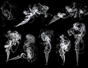 A collection of eight white smoke designs on a black background