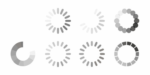 Fototapeta premium Various grayscale loading spinners and progress indicators displayed in a row