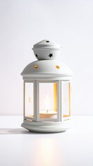 Ornate White Metal Lantern with Burning Candle Inside Casts Warm Light Against a Clean White Background
