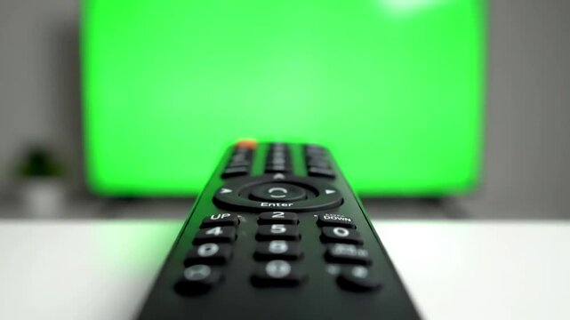 Clean UI Integration Background with person pointing a tv remote and pressing buttons in front of green screen distortion, overlay, glitch, static noise, scan lines on black background, 4k animated