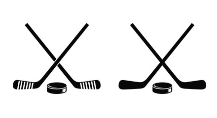 Two crossed hockey sticks and pucks in a dark silhouette © md