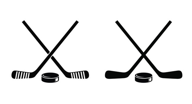 Two crossed hockey sticks and pucks in a dark silhouette