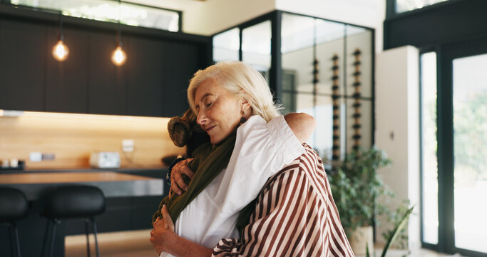Friends, women and hug in home for comfort, compassion and emotional connection for understanding. Support, gratitude and mature people with embrace for kindness, reliable and care for relationship