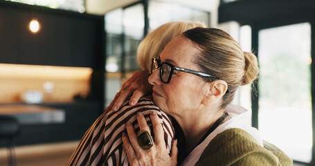 Friends, mature women and hug in house for support, compassion and emotional connection for...