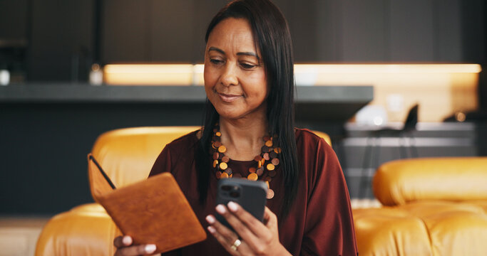 Happy woman, passport and reading in home with phone, travel plan or booking ticket for overseas trip. Mature person, smile and ID with tech, airline website and international holiday for retirement.