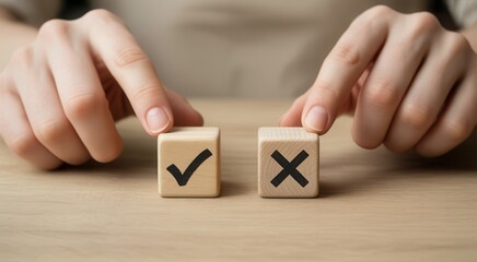 Hands choosing between two wooden blocks with checkmark and cross symbols on a wooden table