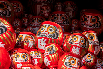 DARUMA dollss with Japaness word, which means victory, in Kachioji Temple Osaka Japan