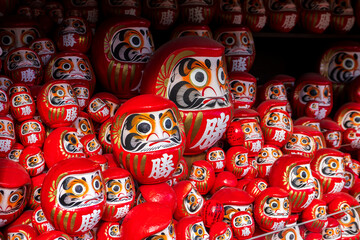 DARUMA dollss with Japaness word, which means victory, in Kachioji Temple Osaka Japan