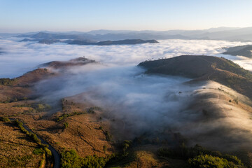 Landscape of Morning Mist with Mountain Layer. mountain ridge and clouds in rural jungle bush forest