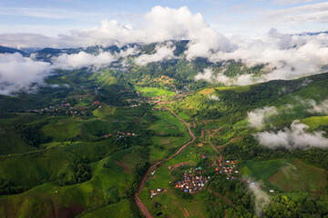 Landscape of Morning Mist with Mountain Layer. mountain ridge and clouds in rural jungle bush forest