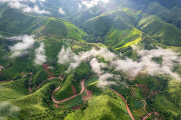 Landscape of Morning Mist with Mountain Layer. mountain ridge and clouds in rural jungle bush forest