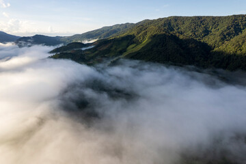 Landscape of Morning Mist with Mountain Layer. mountain ridge and clouds in rural jungle bush forest