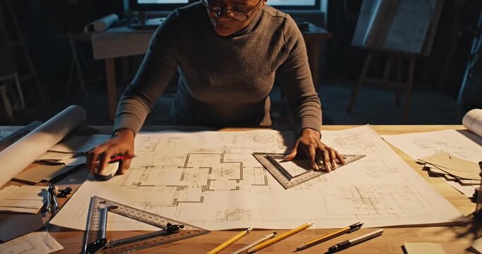 Man working on architectural plans.