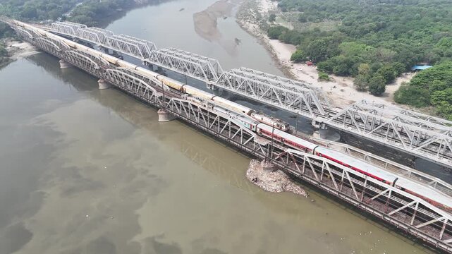 Aerial view of old iron bridge, Loha pul at Yamuna River in Delhi, Train is going on the bridge
