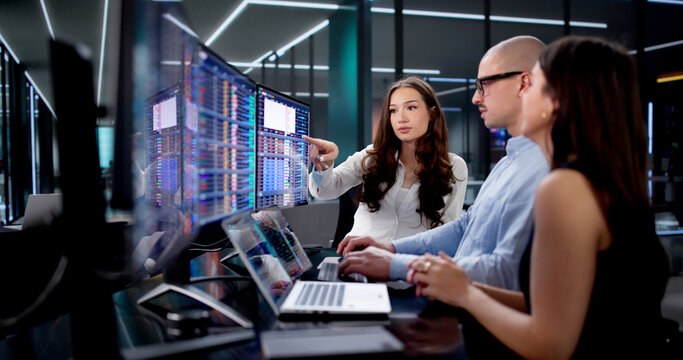 Caucasian Data Analyst Using Spreadsheet On Desktop