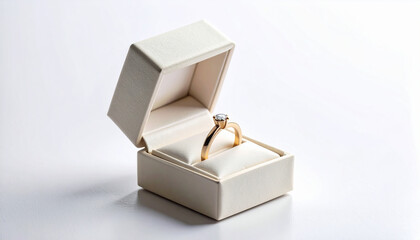 Gold ring with diamond in open jewelry box on white background