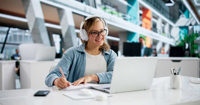 Focused Young Woman Taking Detailed Notes During Online Education Webinar