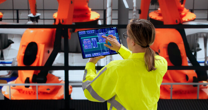 Woman Control Technician Inspecting Car Assembly Line