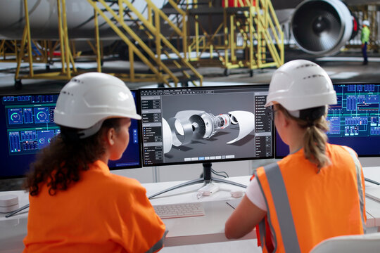 Aerospace Engineer Inspects Aircraft In Airport Maintenance Facility