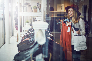 Window, shopping and woman in clothes store at mall for choice of sale, discount or deal. Decision,...