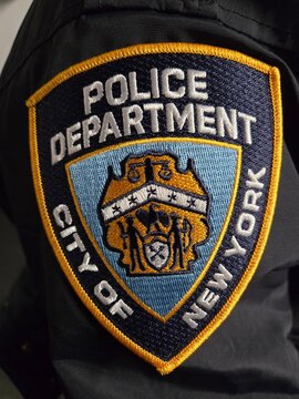 New York, New York, United States, December 15, 2025, City of New York Police Department patch on the shoulder of a uniform jacket. Close up.