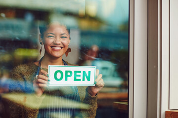 Open sign, portrait and window with woman in coffee shop for management of small business. Grand...