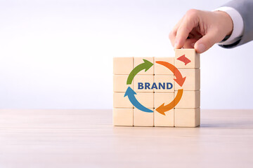 Brand development process with colorful arrows and business hand stacking wooden blocks for marketing strategy