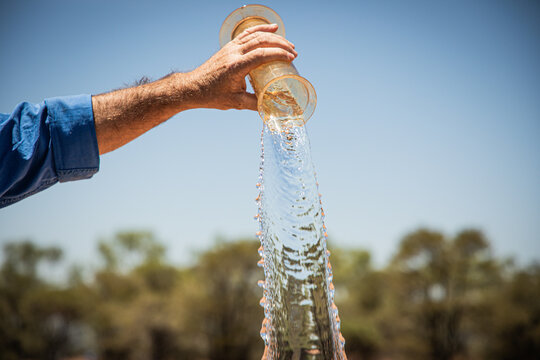 Tipping water out of a rain gauge