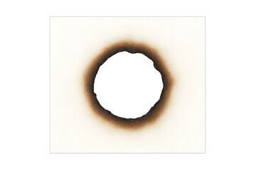 White paper with a circular burnt hole surrounded by charred brown and black scorch marks