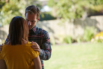 Fototapeta premium Sad, comfort and couple with support, anxiety and compassion for grief, empathy and loss. Relationship, man and woman with emotion, mental health and understanding with sympathy, marriage and love