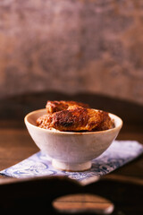 Fried chicken wings on a rustic background. Soft focus.