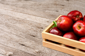 red apples in a wooden box