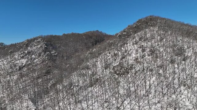 Drone footage, Winter landscape, river, mountain, village in Gapyeong city, South Korea