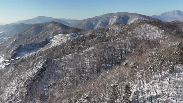 Drone footage, Winter landscape, river, mountain, village in Gapyeon city, South Korea